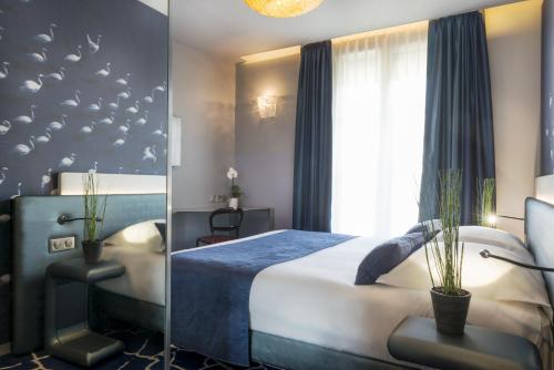 Postel nebo postele na pokoji v ubytování Le Bon Hôtel