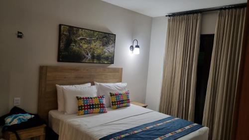 Ένα ή περισσότερα κρεβάτια σε δωμάτιο στο QUINTA SANTA BÁRBARA ECO RESORT