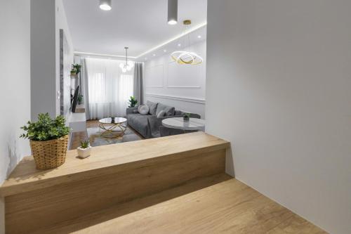 a living room with a couch and a table at Apartment Marina in Novi Sad