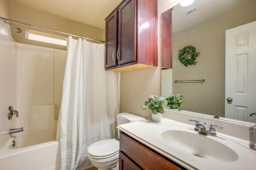 a bathroom with a sink and a toilet and a shower at Pet-Friendly Texas Retreat with Fenced-In Yard! in Bryan