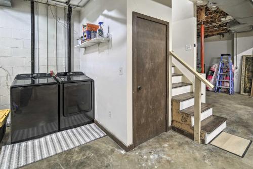 a garage with a door and a staircase in it at Deck and Mtn Views Fain Chalet in Kingsport in Kingsport