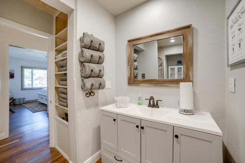 a bathroom with a sink and a mirror at Broadmoor Getaway with Pickleball Court! in Colorado Springs