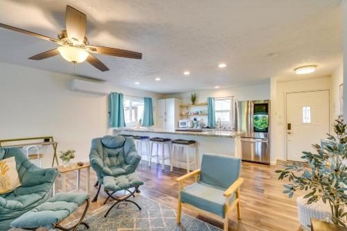 a living room with chairs and a ceiling fan at 2 Mi to Town and Beach! Lovely Kailua-Kona Home in Kailua-Kona