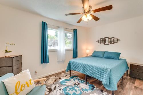 a bedroom with a bed and a ceiling fan at 2 Mi to Town and Beach! Lovely Kailua-Kona Home in Kailua-Kona