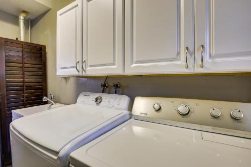 a kitchen with white cabinets and a white stove at Portland Vacation Rental about 11 Miles to Downtown in Portland