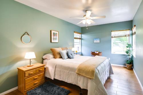 a bedroom with a bed and a ceiling fan at Pet-Friendly San Diego Home with Patio! in San Diego