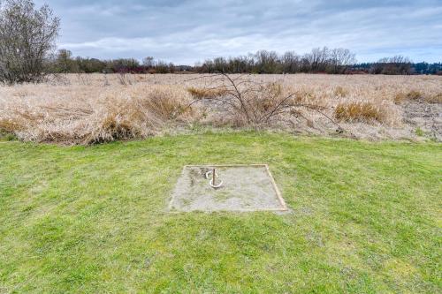 a metal object in the middle of a field at Private Hot Tub Blue Sky Cabin in Sequim in Sequim