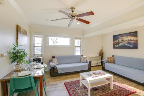 a living room with two couches and a table at Sunny California Retreat Near Knotts Berry Farm! in Long Beach