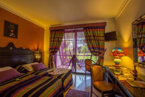 Cama o camas de una habitación en Hotel Argana Agadir