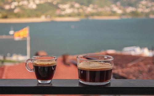 two cups of coffee sitting on a table at Villa Christina 2 in Ohrid