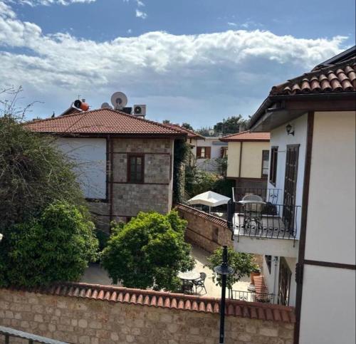 a view of a house with a patio and a building at Ali Apart in Antalya