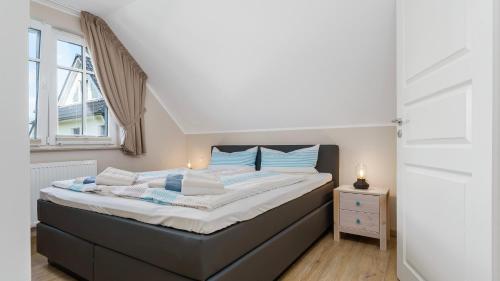 Ein Bett oder Betten in einem Zimmer der Unterkunft Käpt'n Kalle Ferienwohnungen