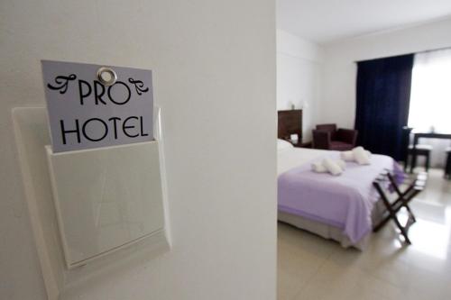 Postel nebo postele na pokoji v ubytování Pro Hotel