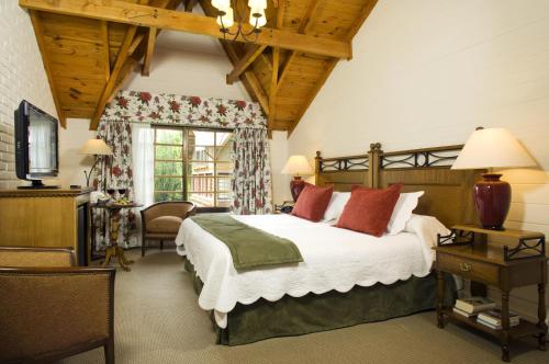 Cama ou camas em um quarto em Hotel Posada Los Alamos