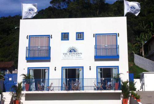 a white building with blue accents at The Hyperion Boutique Hotel in Florianópolis