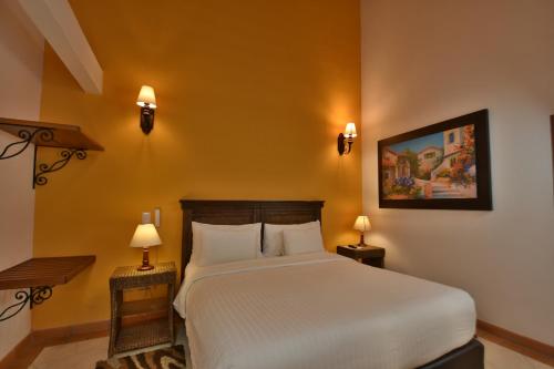 Кровать или кровати в номере Hotel Campanario Real