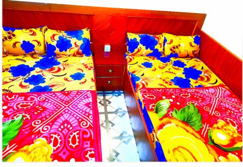 Una cama o camas en una habitación de Shri Holy Family Guest House