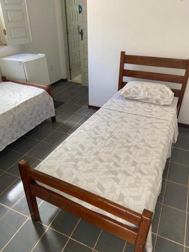 a bedroom with two beds in a room at BUONA SORTE in Lençóis