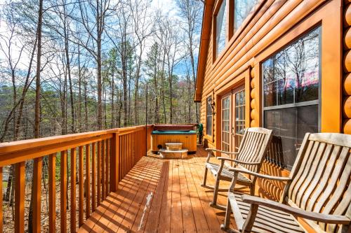 a deck with chairs and a pool table on a cabin at Great Smoky Mountains Cabin!, Secluded, Pet-Kid Friendly! in Sevierville
