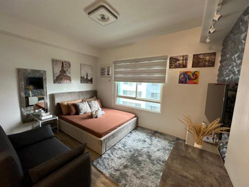 Χώρος καθιστικού στο Cozy condo in Bacolod City