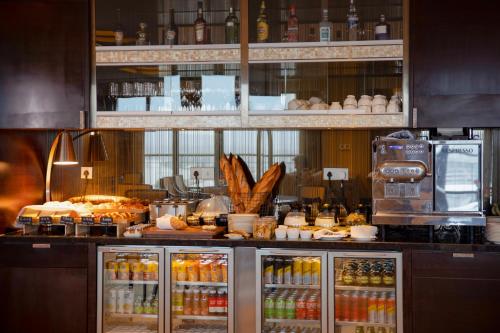 a kitchen with a bunch of food on a counter at Midtown Shangri-La, Hangzhou - around 5 minutes walking distance to West Lake in Hangzhou