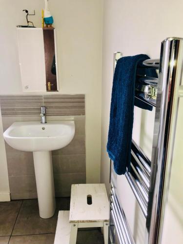 a small bathroom with a sink and a mirror at Private Room Near Airport, The Rabbit & Hilton Templepatrick Ideal for Spa, Weddings & Stopovers in Templepatrick