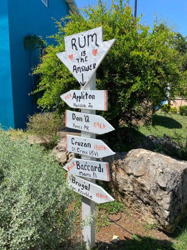 a street sign with arrows pointing in different directions at Castaways Villa in Duncans