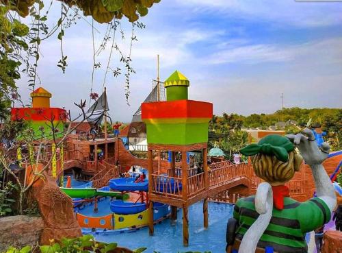 a water park with a water park with many slides at Mutiara Balecatur Guest House in Yogyakarta