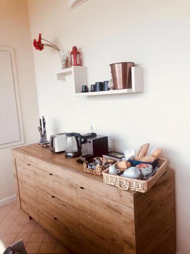 a kitchen with a wooden counter with food on it at Villetta rosso Rubino in Vignale Monferrato