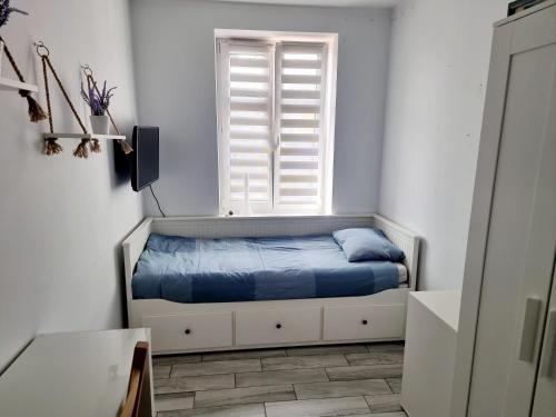 Postel nebo postele na pokoji v ubytování Apartament Katarzynka Toruń