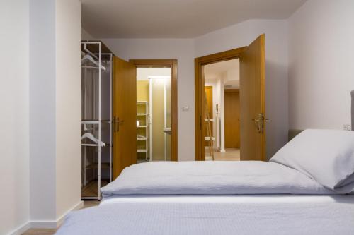 Postel nebo postele na pokoji v ubytování MAMA Apartments