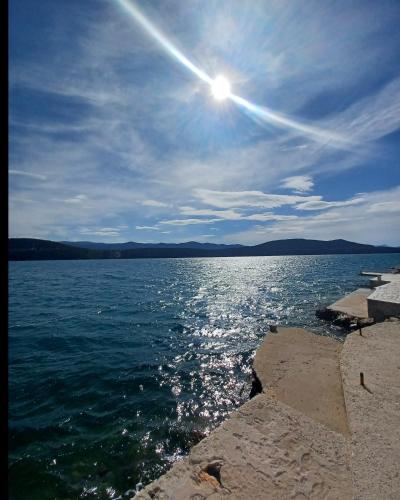a view of a large body of water at Apartmani Leženić Dada in Neum