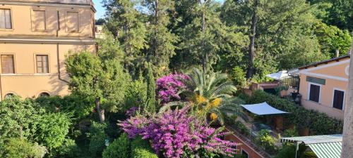 an overhead view of a garden with flowers and trees at Villa Riari Garden in Rome