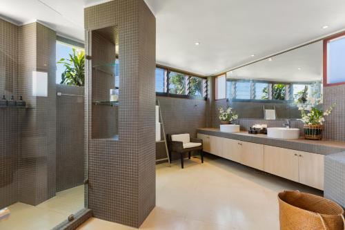 a bathroom with a double sink and a shower at Panorama Summit - Private Pool with Sunset View in Plai Laem