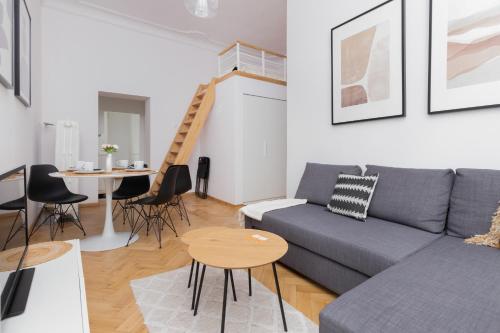 a living room with a couch and a table at City Centre & Cosy Apartment by Renters in Gdańsk