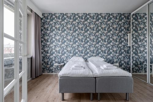Postel nebo postele na pokoji v ubytování 2ndhomes Tampere "Puisto" Apartment