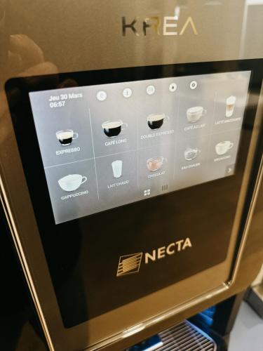 a microwave oven with a menu on the screen at Vini Hotel in Beaune