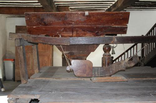 an old wooden table sitting on top of a wooden floor at GITE DU MOULIN in Arudy