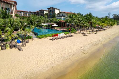 an aerial view of the beach at a resort at Dusit Princess Moonrise Beach Resort in Phu Quoc