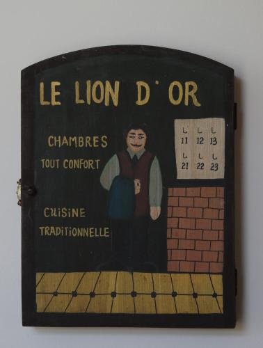 a sign with a picture of a man on a wall at GITE DU MOULIN in Arudy