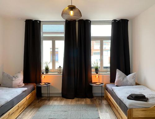 Postel nebo postele na pokoji v ubytování Elbnahe Ferienwohnung mit 2 Schlafzimmern