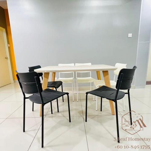 a white table and chairs in a room at KULAI IOI MALL D'Putra Suites Near JPO Senai Airport in Kampong Saleng
