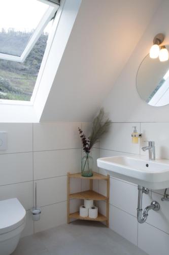 a bathroom with a sink and a toilet at Ferienwohnung Vino in Cochem