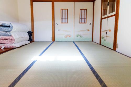 a room with a floor that has a blue line on it at 伊豆の宿　静海 in Ito