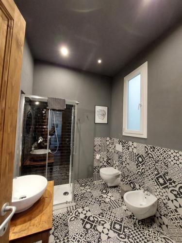 a bathroom with two sinks and a shower at Savieri Home in Florence in Florence