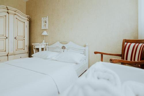 Кровать или кровати в номере Piena muiža - Berghof Hotel & SPA