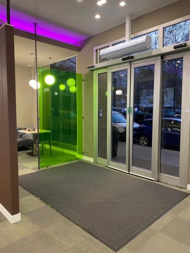a room with a glass door with a parking lot at Hotel Miramonti in Turin