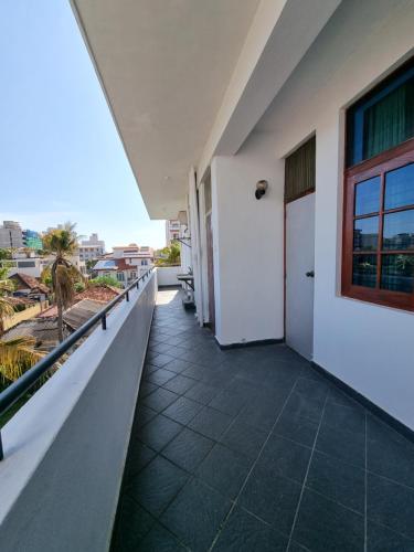 a balcony with a white door and a window at Apartment in Colombo in Colombo