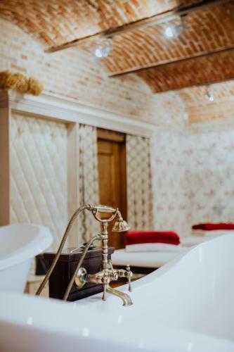 Кровать или кровати в номере Piena muiža - Berghof Hotel & SPA