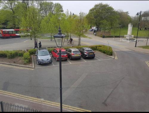 a group of cars parked in a parking lot at Plaza lodge in Gillingham